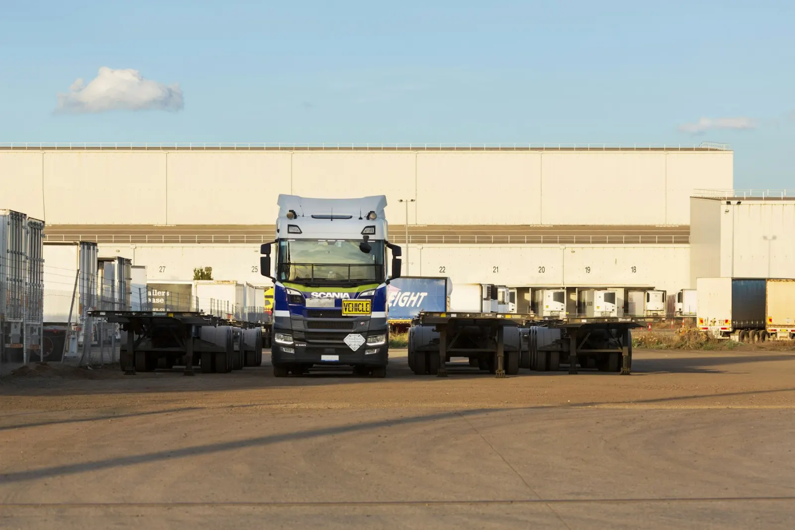 Semi trailers staged outside a warehouse freight yard