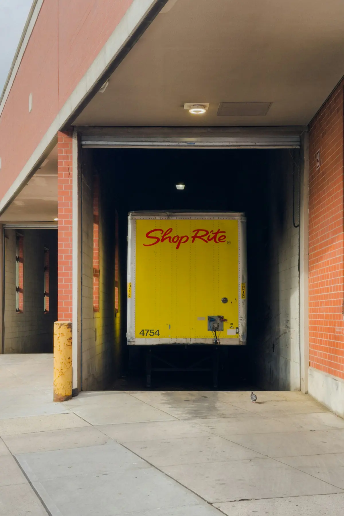 Delivery truck backed into a warehouse loading dock